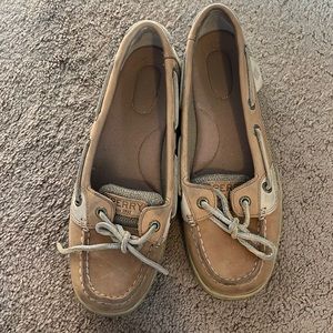 Tan Sperry boat shoes.